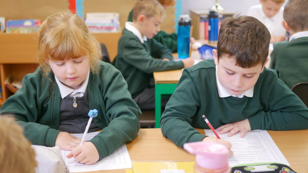 P1170857 pupils writing in class at shorne cofe primary school