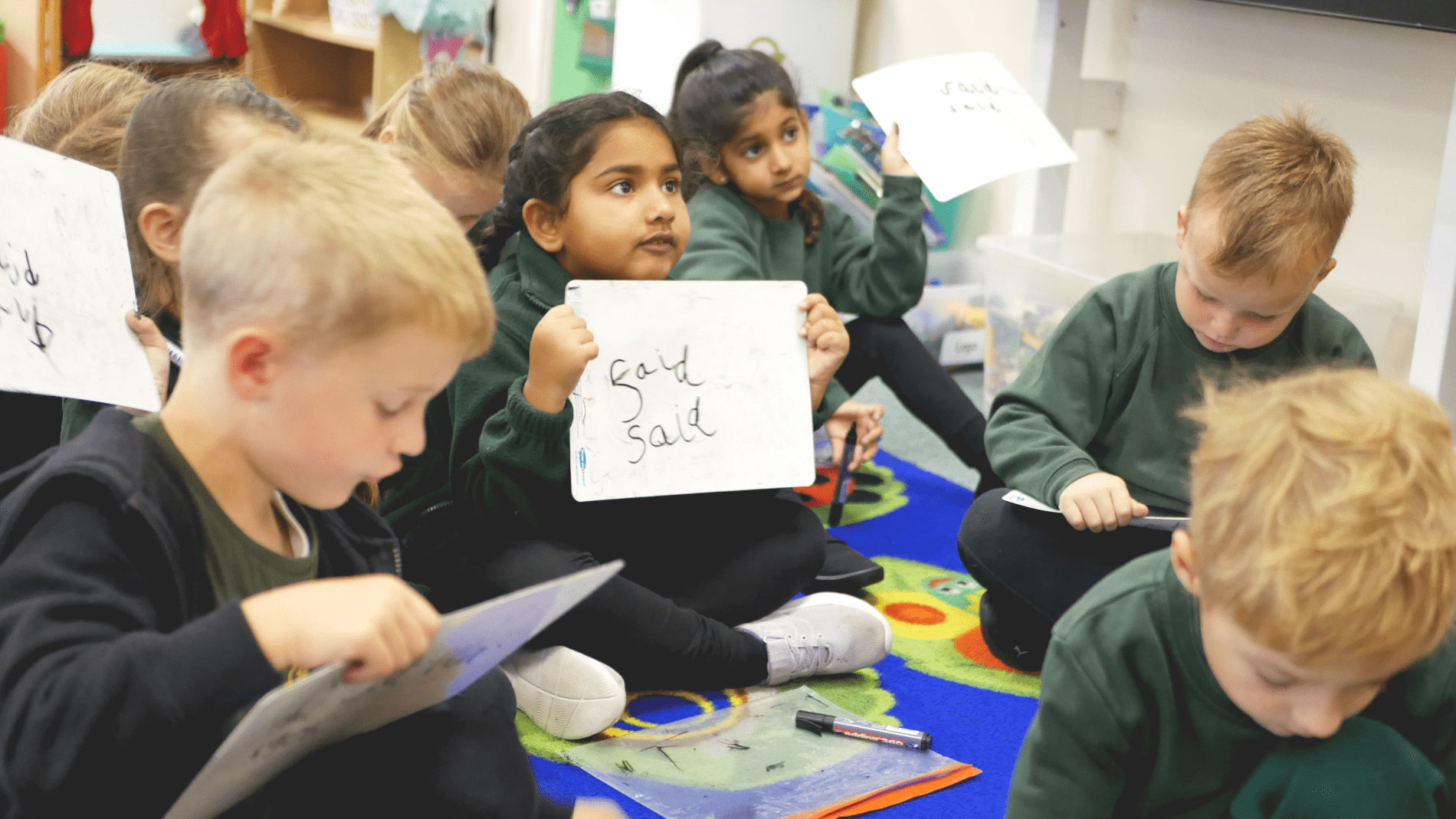 P1170907 children in eyfs using whiteboards to pratice phonics at shorne primary school