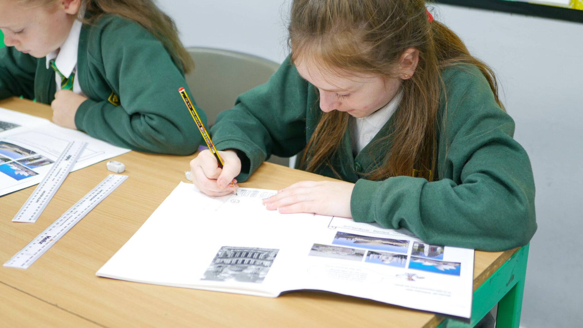 P1180152 year 6 pupil drawing building in art and design lesson