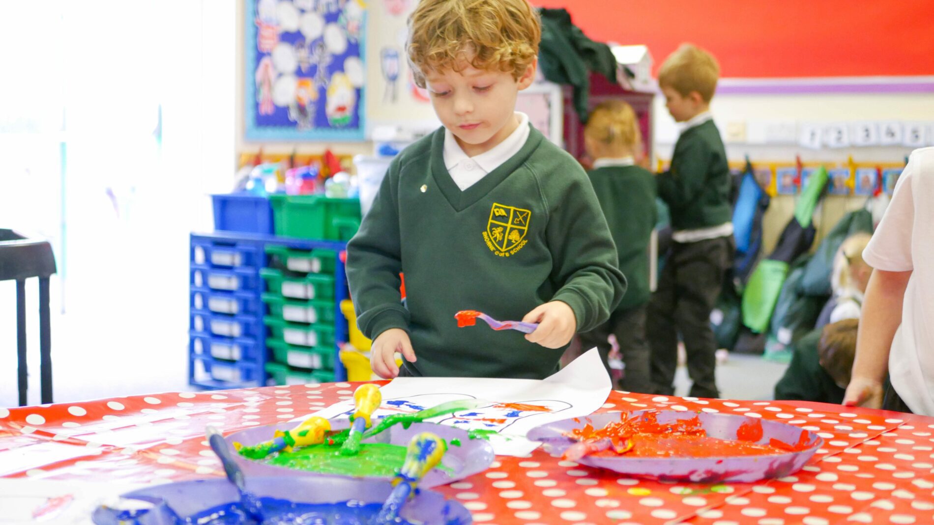 P1180179 (1) EYFS pupil in art lesson painting