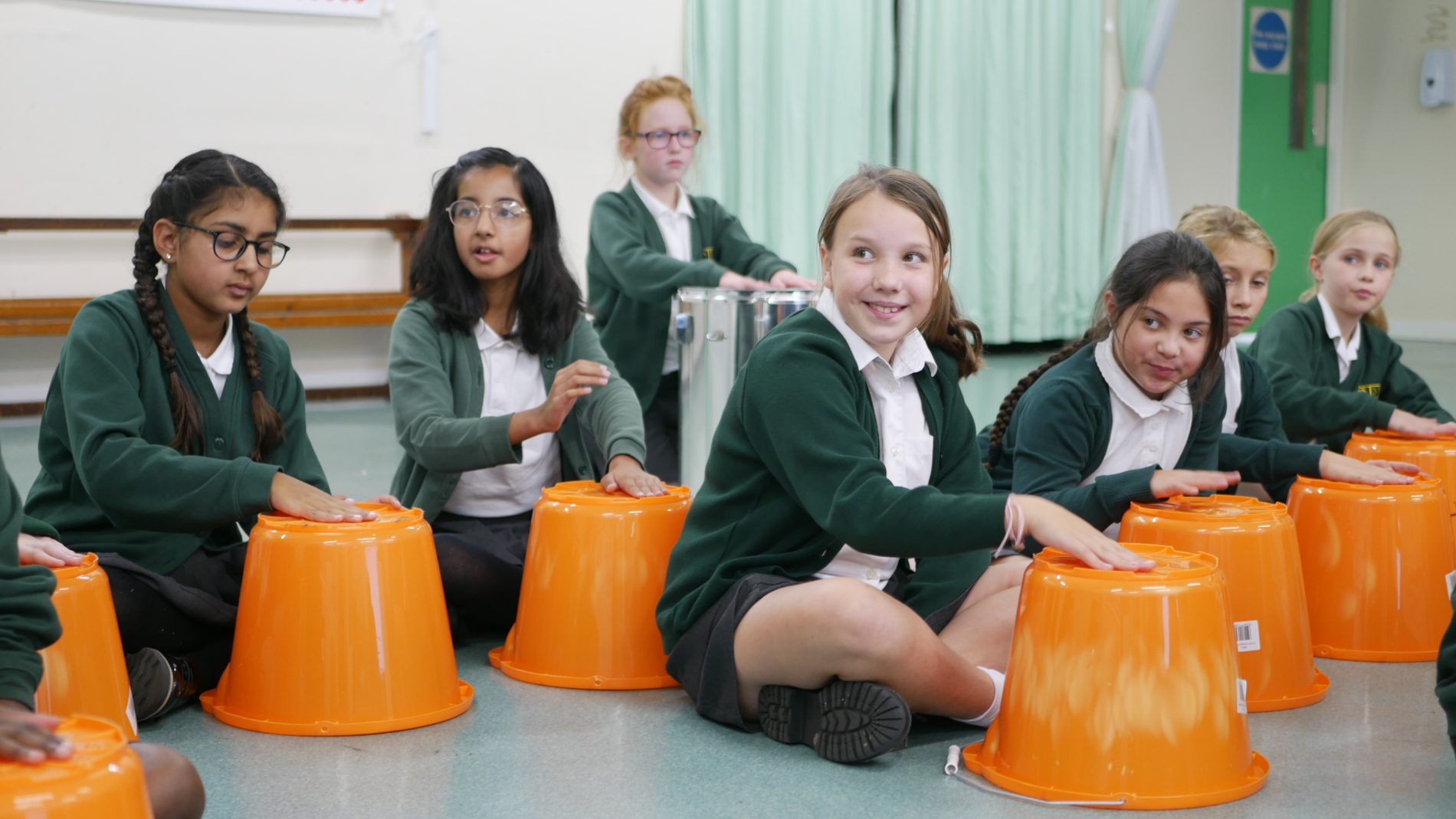 P1180257 pupils in music lesson pratising drumming at shorne primary school