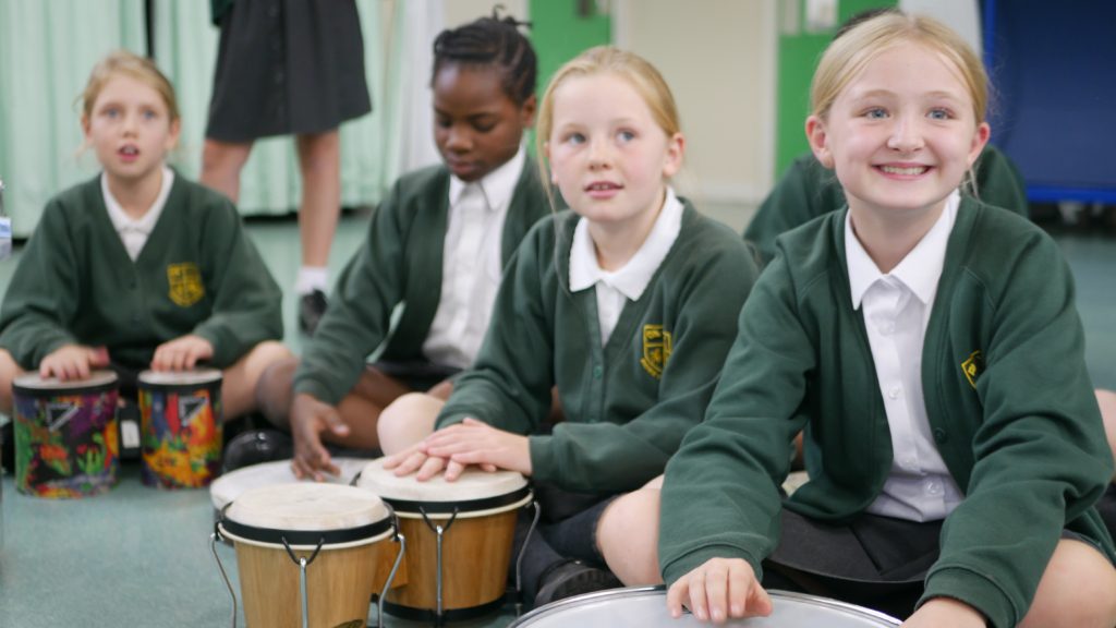 P1180318 pupils at shorne primary school learning how to play drums in music lessons