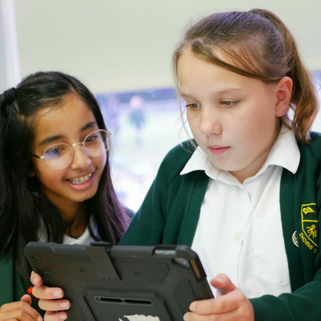Pupils using ipads in computing to research at shorne primary school