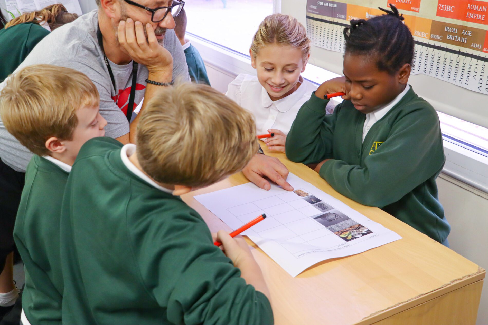 teacher helping pupils at shorne primary school