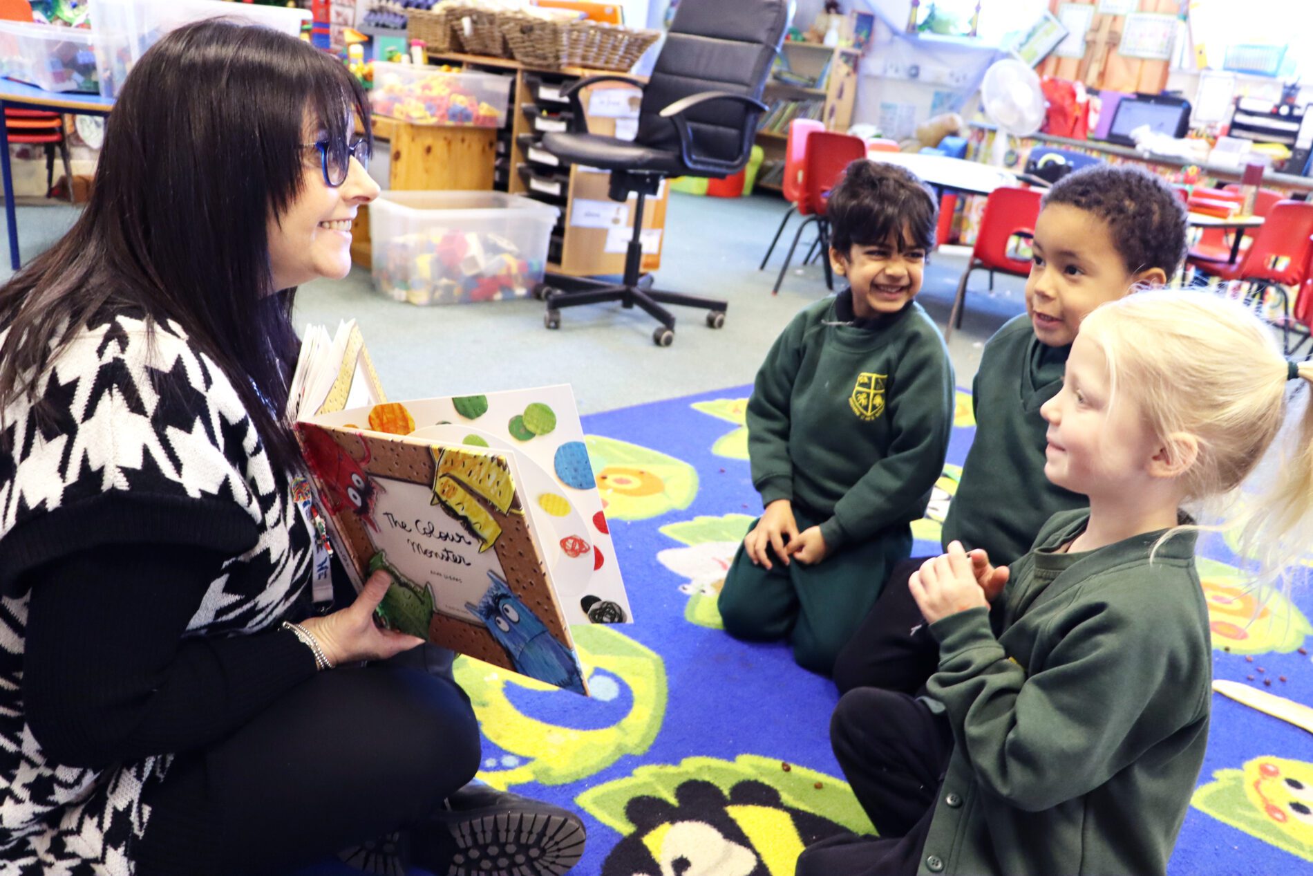 pupils reading the colour monster in PSHE to understand emotions at shorne primary school in eyfs