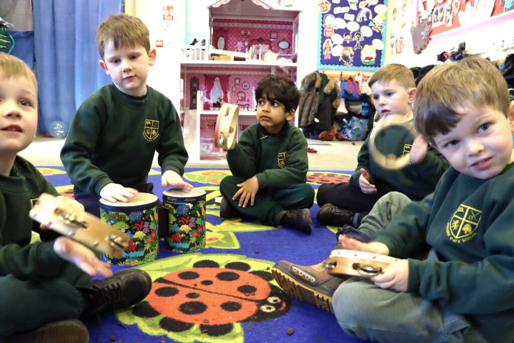 EYFS pupils making music