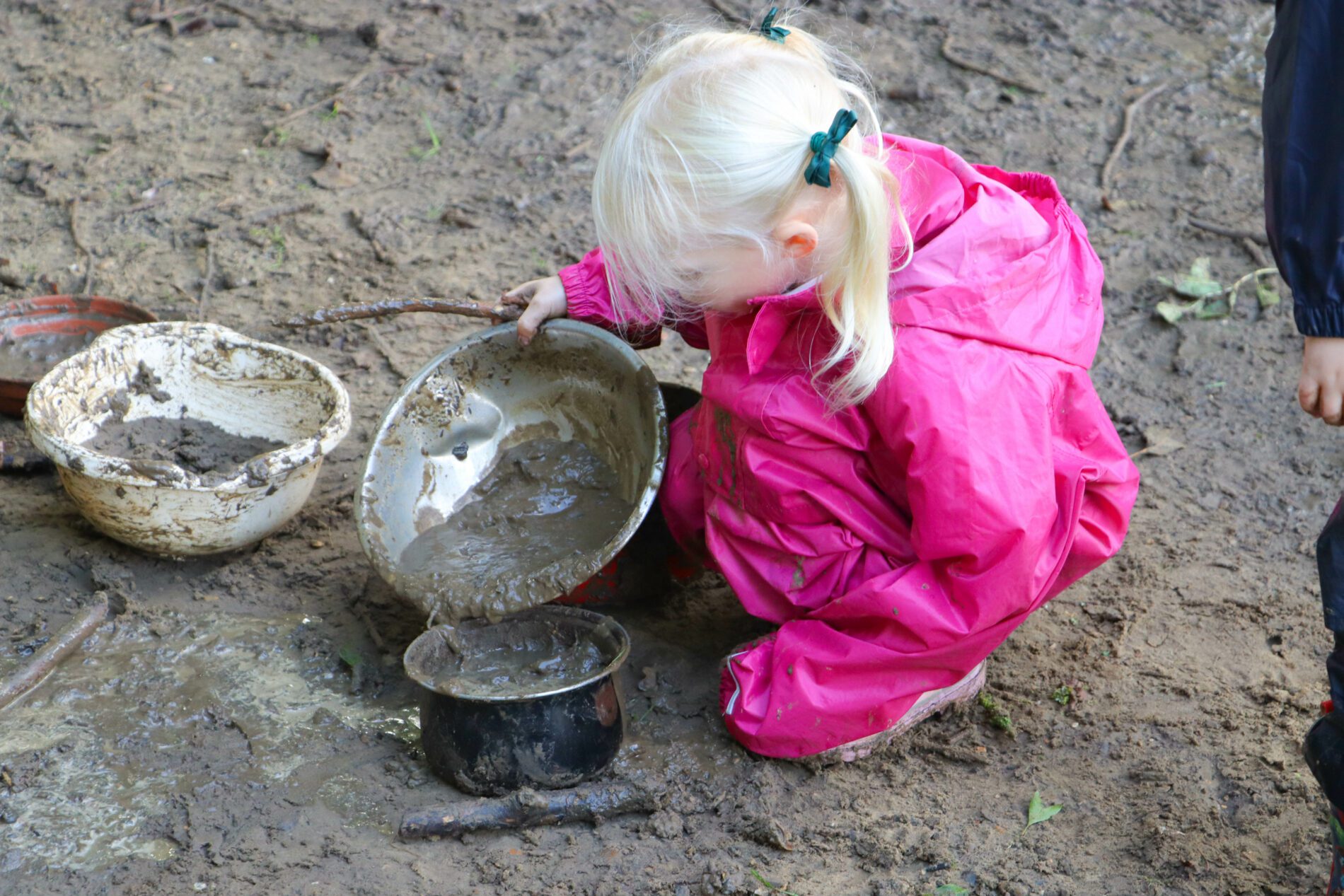 IMG_3923 Girl playing with mud during outdoor learning